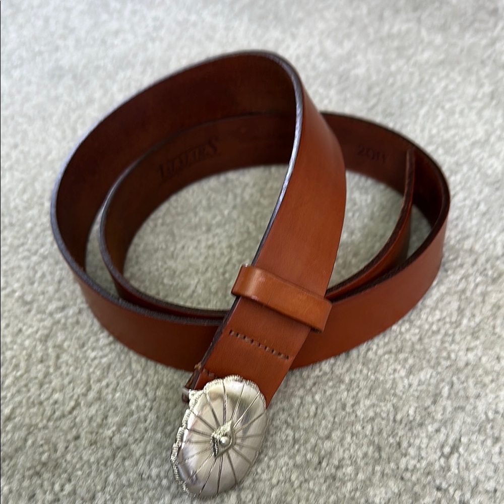 Brown Leather belt with elegant silver buckle. Very comfortable & flexible.